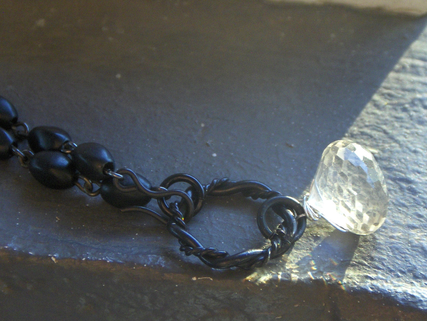 Hallowed be thy name. Crystal Quartz Onion Briolette and vintage rosary upcycled necklace