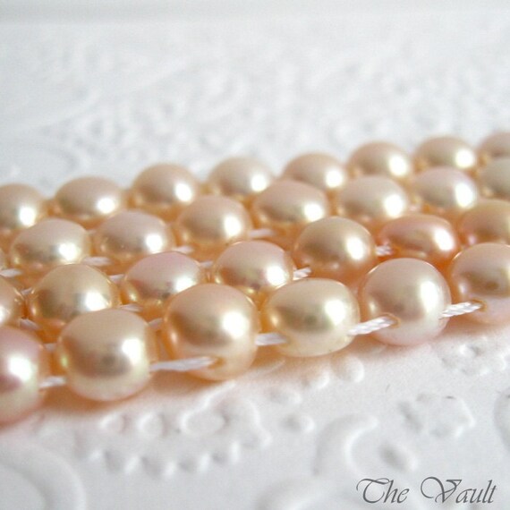 Pearls, double drilled buttons, peach, 6mm, 16 inch full strand