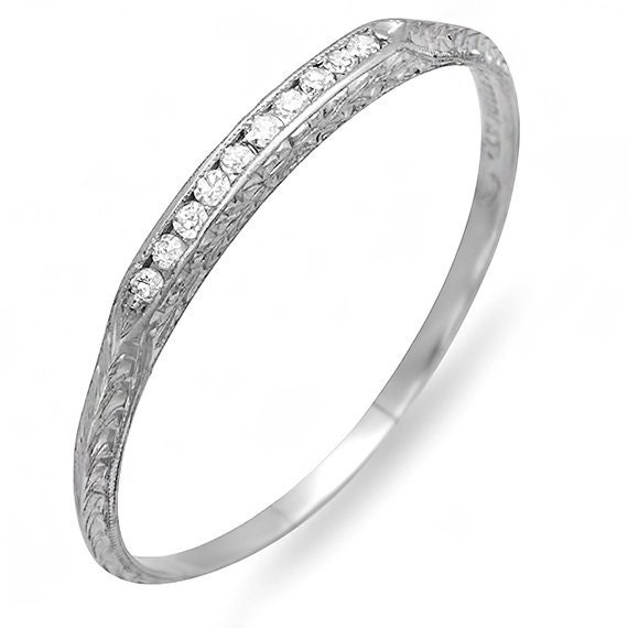 This engraved Platnum Diamond Estate Wedding Band is plain and simple and 
