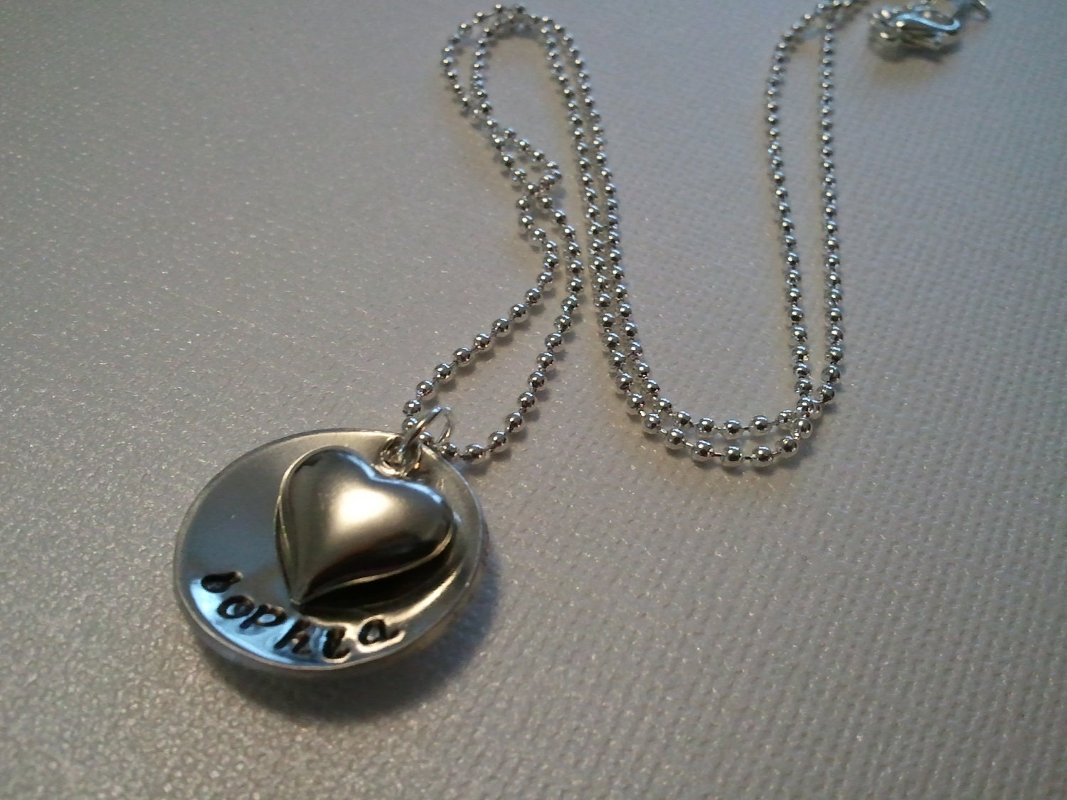 mommy necklace with heart charm. cupped disc. your name of choice. Pretty cursive font. Ball or snake chain option.