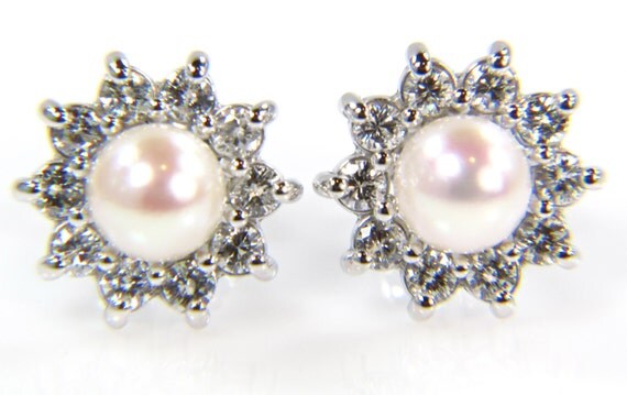 I would go with simple pearl or diamond studs Something like this