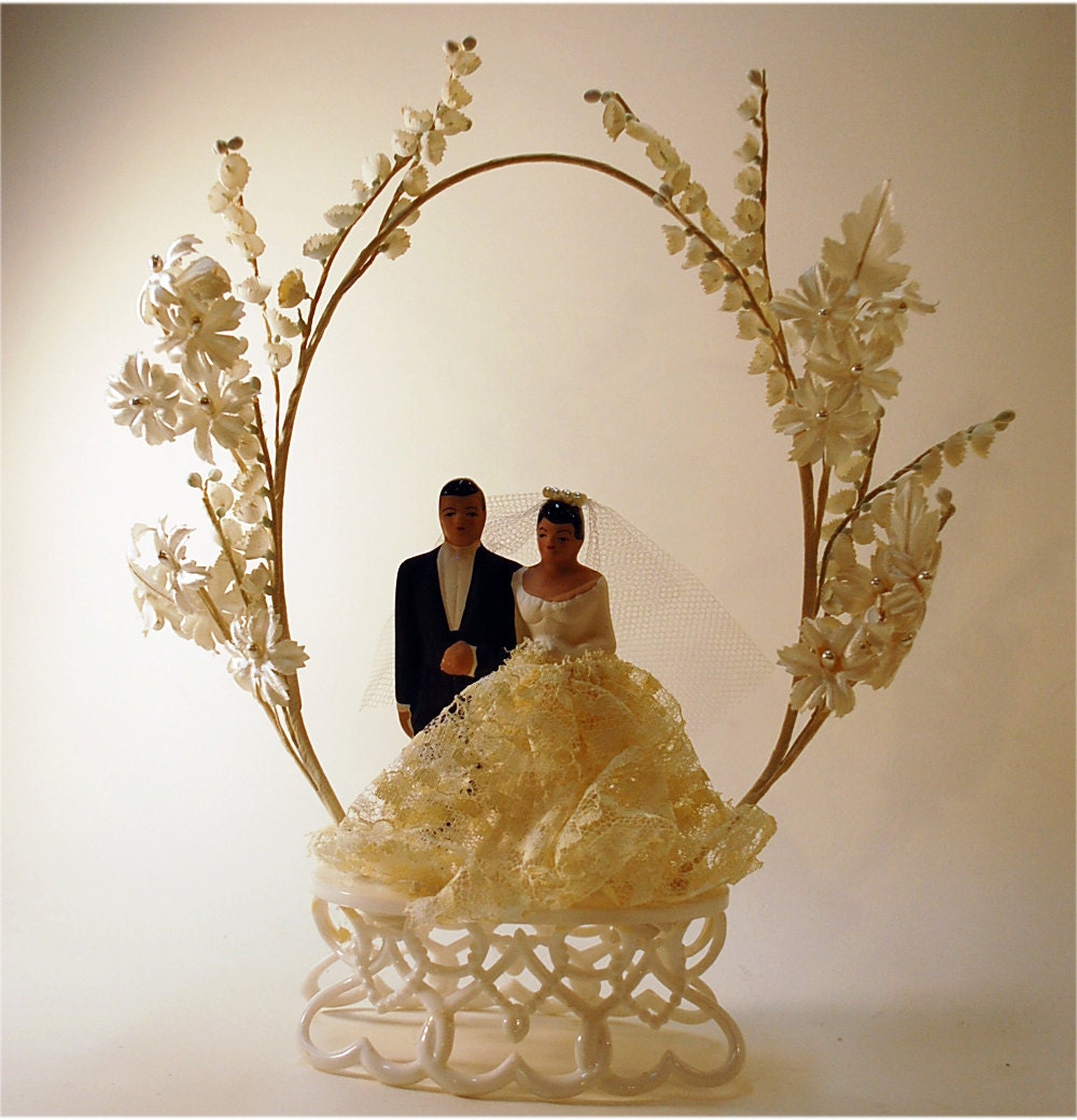 vintage wedding cake topper bride and groom under floral arch chalk ware and