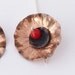 Tiny black poppy earrings. Copper flowers with tiny black poppy centres.