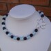 Sodalite and Moonstone necklace with flower charm by evecollection Sodalite and Moonstone necklace with flower charm by evecollection