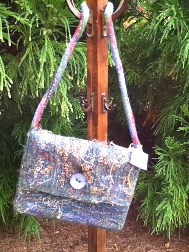 a wet felted computer case fits a 13x9 sized laptop or smaller or an ipad