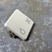 Recycled Apple Command Key Pin