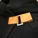 Black hood sweater with camel leather clasps