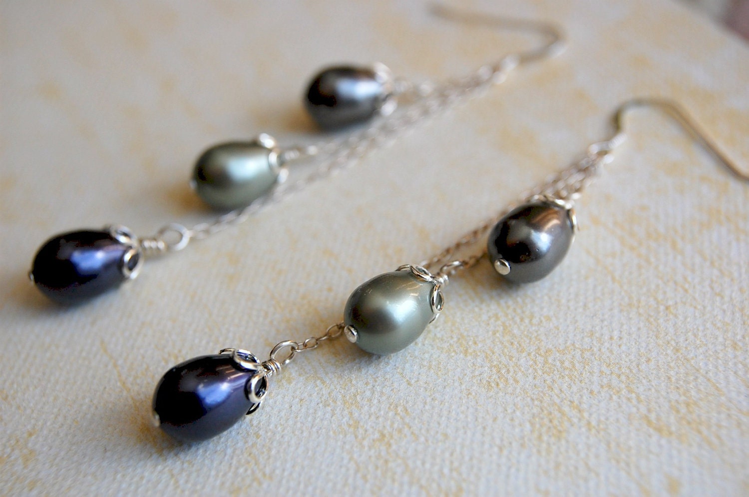 Three pearl drop earrings. Purple. Grey. Green. Spring buds.