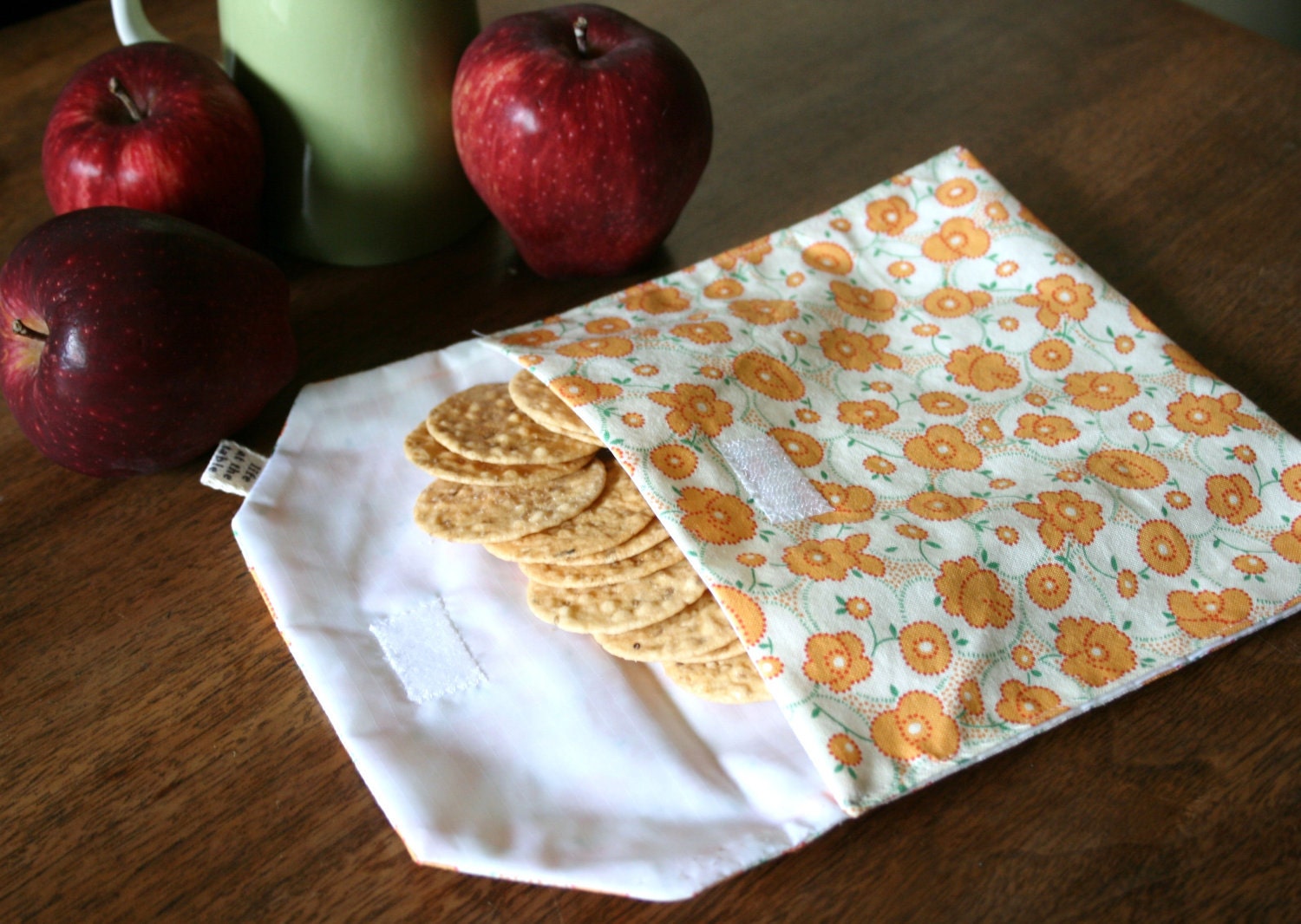 pair of reusable, lined sandwich bags in orange floral & dot stripe