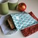 pair of reusable, lined sandwich bags in blue mod & red floral