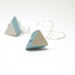 Geometric neon blue and  white triangular earrings.