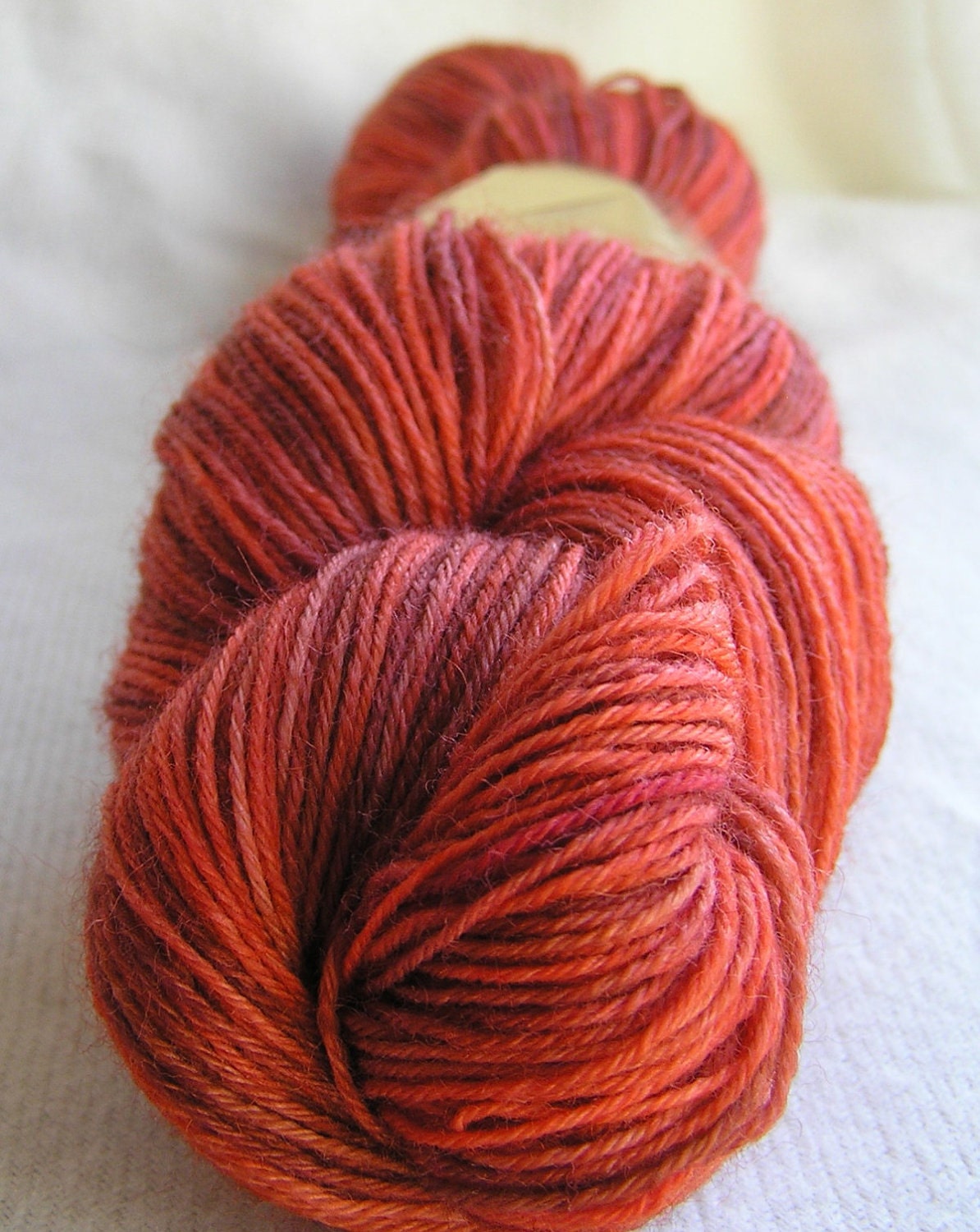 100g superwash sock yarn with nylon, ginger, orange, brown
