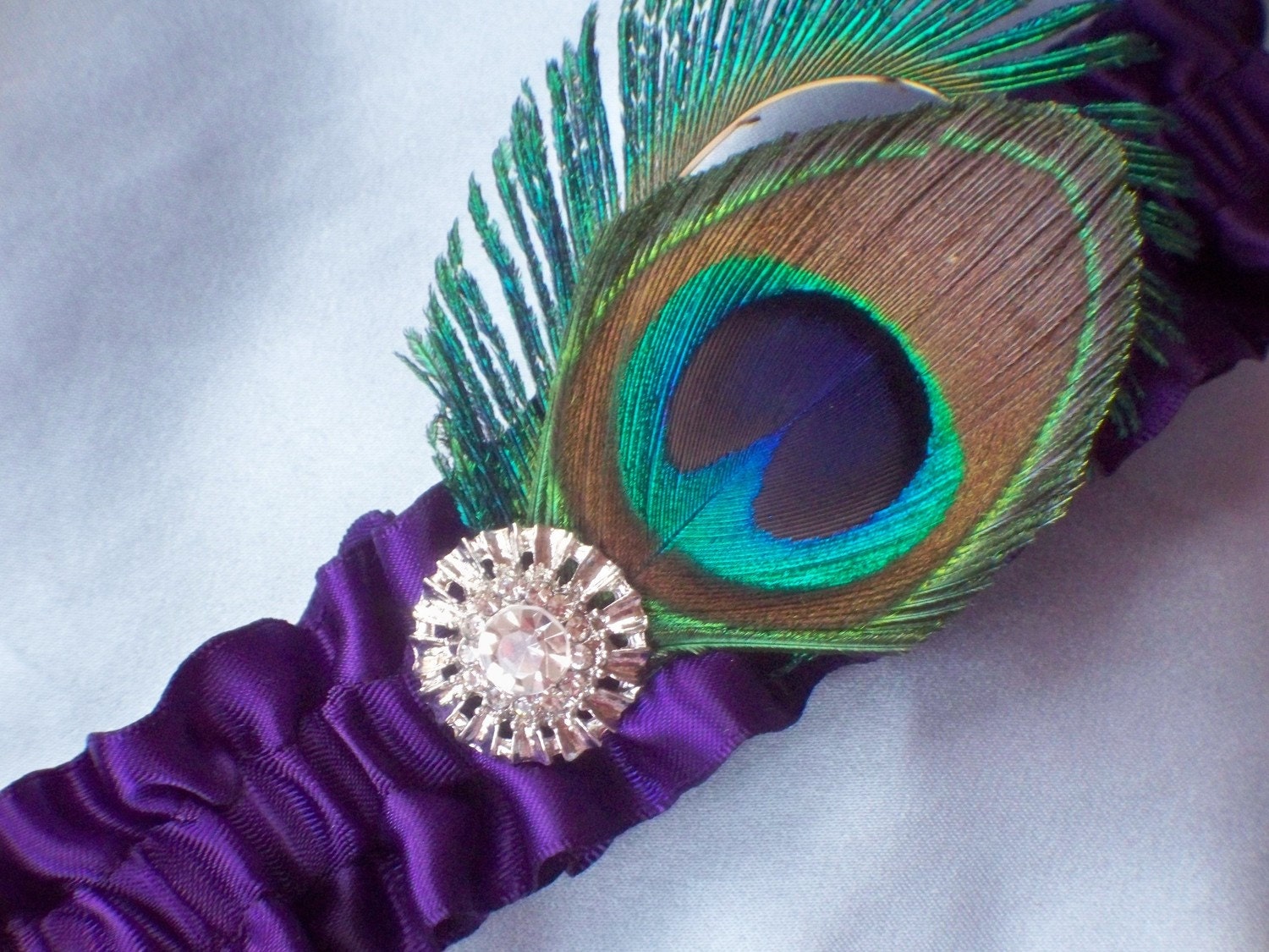 wedding arrangements with peacock feathers