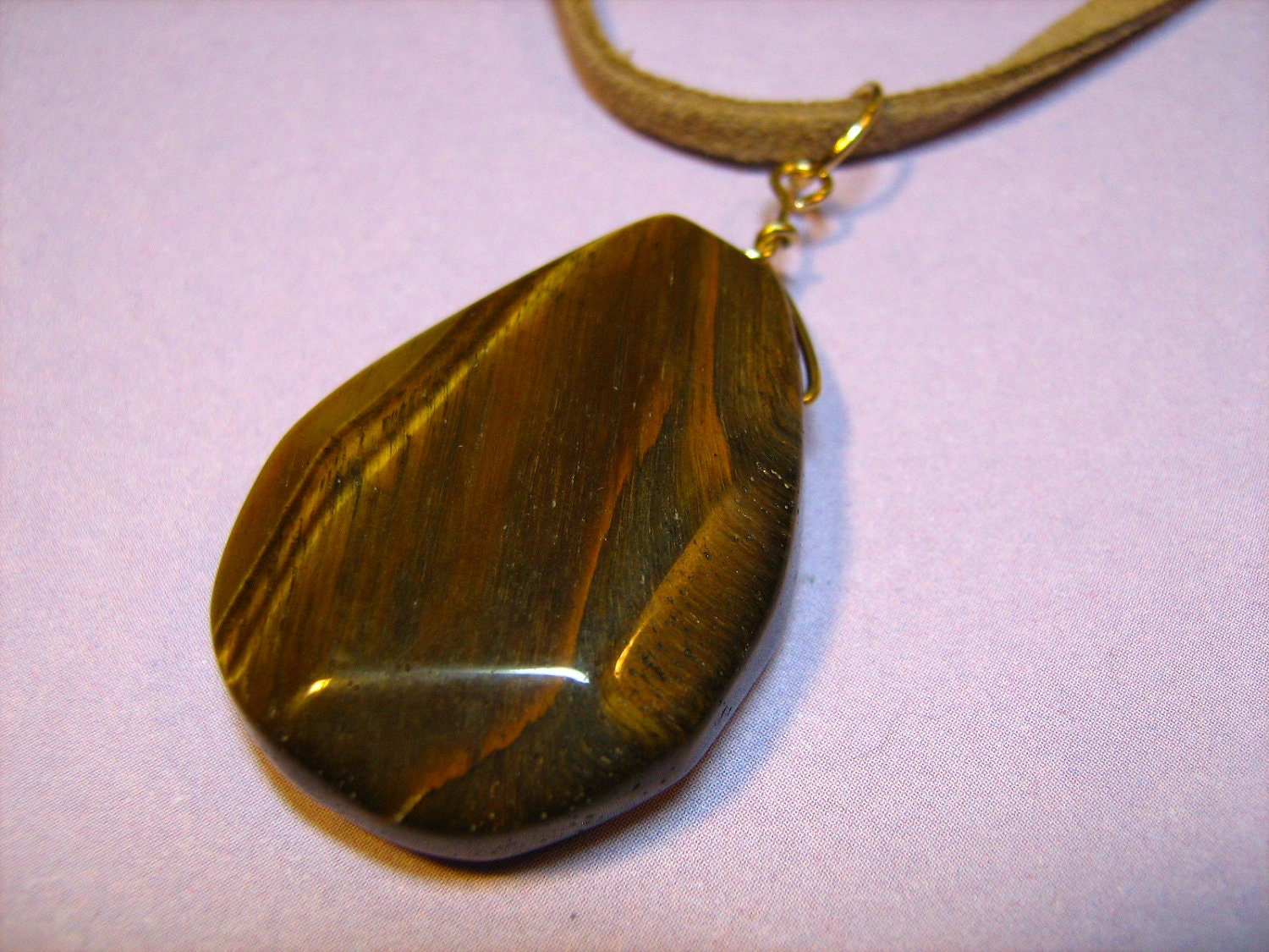 Necklace: Tiger's Eye Stone Pendant with Goldtone Findings and a Tan Suede Cord Necklace for Women Necklace: Tiger's Eye Stone Pendant with Goldtone Findings and a Tan Suede Cord Necklace for Women