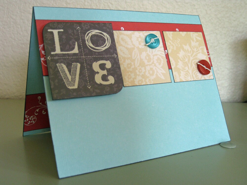 Striking wedding card featuring vibrant colors of turquoise