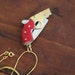 25% off sale plus Free Shipping with code BFCM12: Gun Pocket Knife Necklace with Maroon Red Bakelite Handle