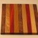 cutting board/chopping block made of many different woods.10 x 8.5" with jatoba , jatoba, ash, paduck, oak and jatoba center