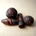 Hollow textile style polymer beads