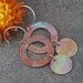 Hammered and Heat Oxidized Copper and Sterling Silver Earrings.
