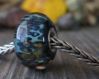 Artisan handmade bracelet charm. AGB sterling silver lined boro glass lampwork bead. Dark mysterious colors. With Your