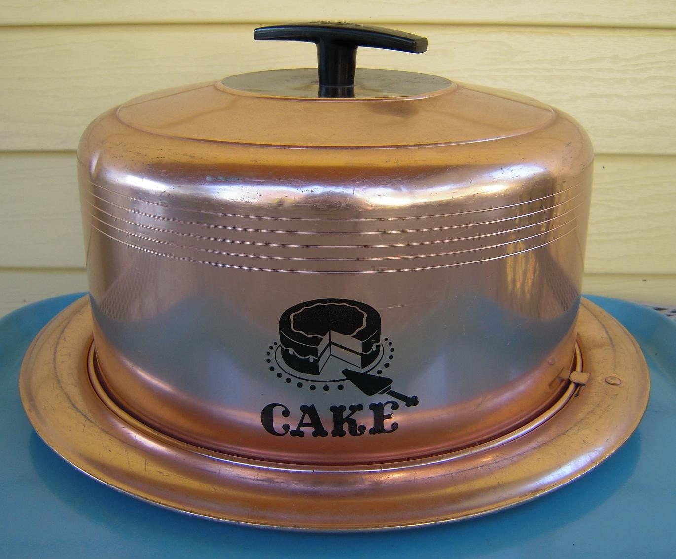 vintage copper colored cake carrier