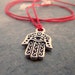 hamsa hand necklace, silver, red silk cord