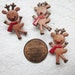 Dancing little reindeer with red scarf shank buttons - 24 pcs