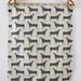 Herds in grey - tea towel