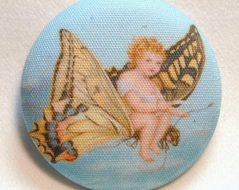 Child Riding Butterfly Hand Printed Fabric Covered Button 1 and 1/2 inch Diameter