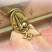 vinTaGe 1939 new york worlds fair souvenir pin . 2 part . antiqued gold oval with chain and tiny date pin