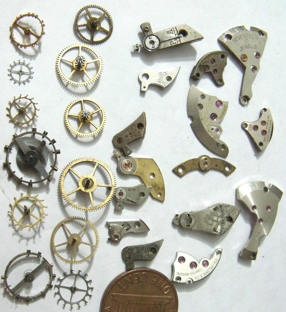 Mixed Bag of Pocket Watch Gears Cogs Wheels And Parts