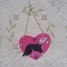 Ferret on heart window hanger