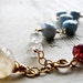 V A S T. S K Y.... Blue opals, garnet, moonstone on gold bracelet Ooak