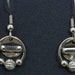 Silver dangly earrings with silver beads