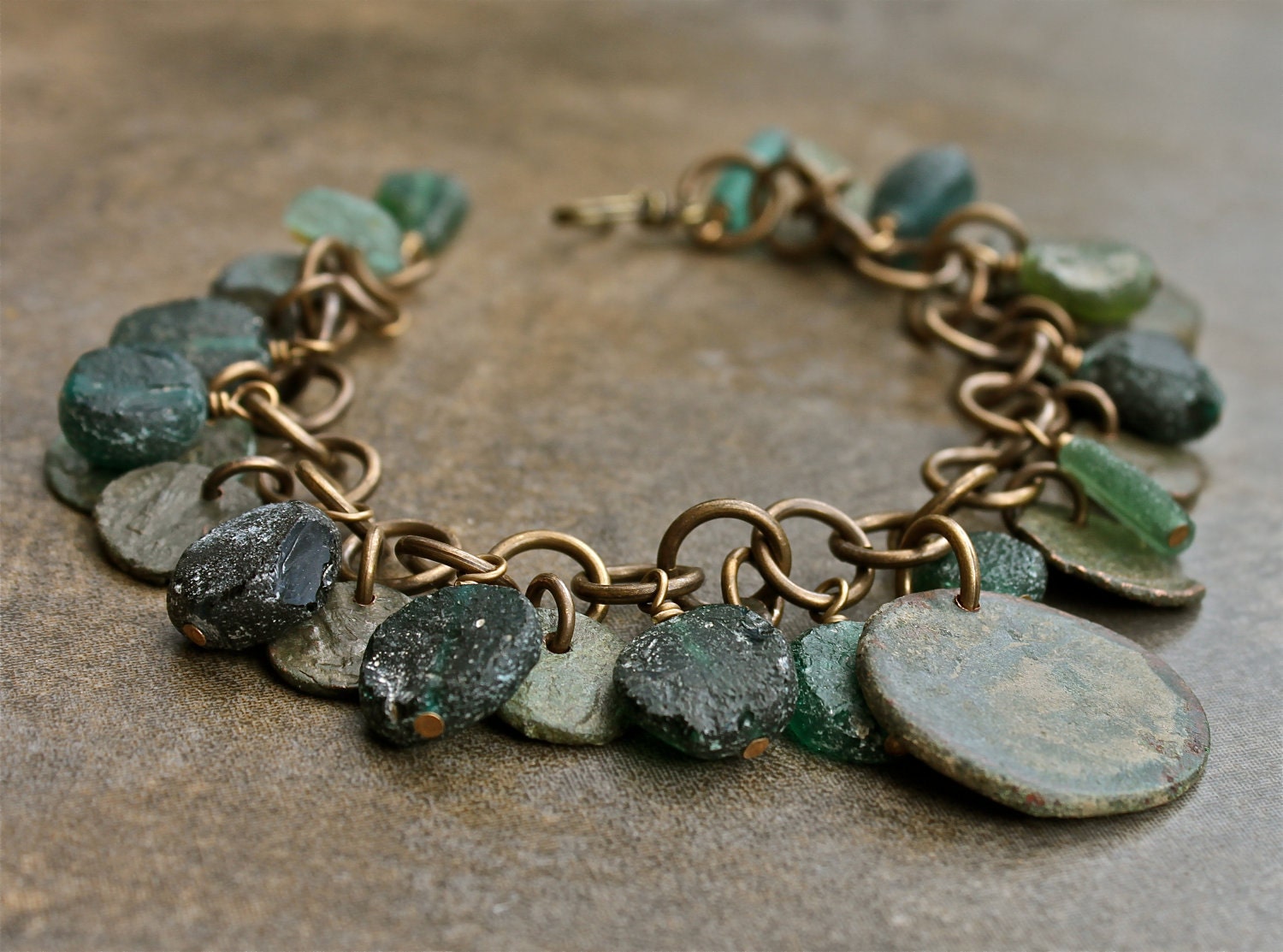 Ancient Roman coin and glass bracelet