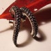 Unmatched Octopus Tentacle Earrings - Legs And Curvaceous