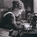 Seamstress at Her Sewing Machine in Window Light