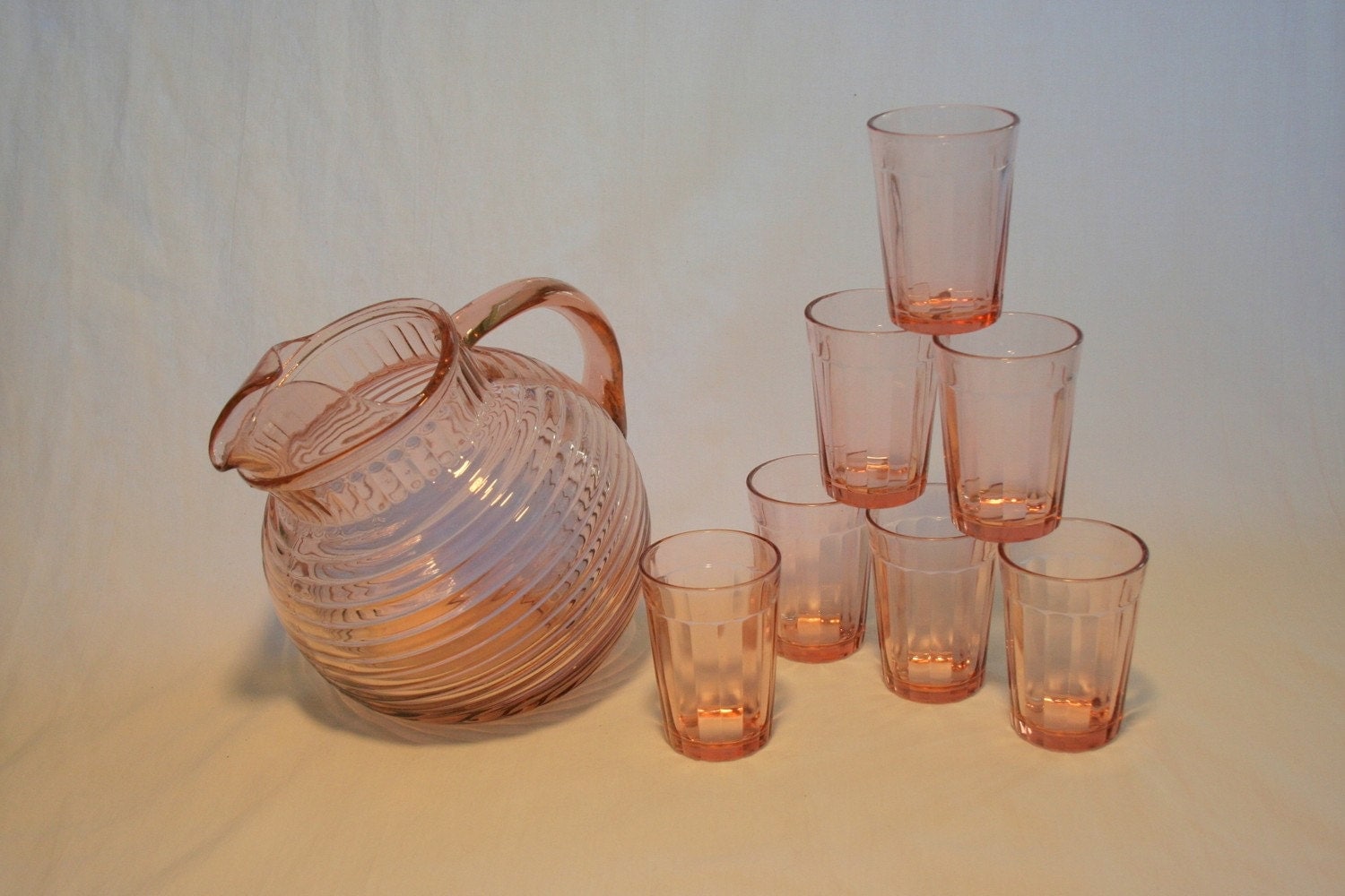 Pink Depression Glass pitcher and Glasses