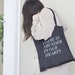 thunder in our hearts tote in black