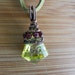 Peridot Green Cubic Zirconia Faceted Drop with Garnet beads Wrapped in Oxidized Copper wire Pendant