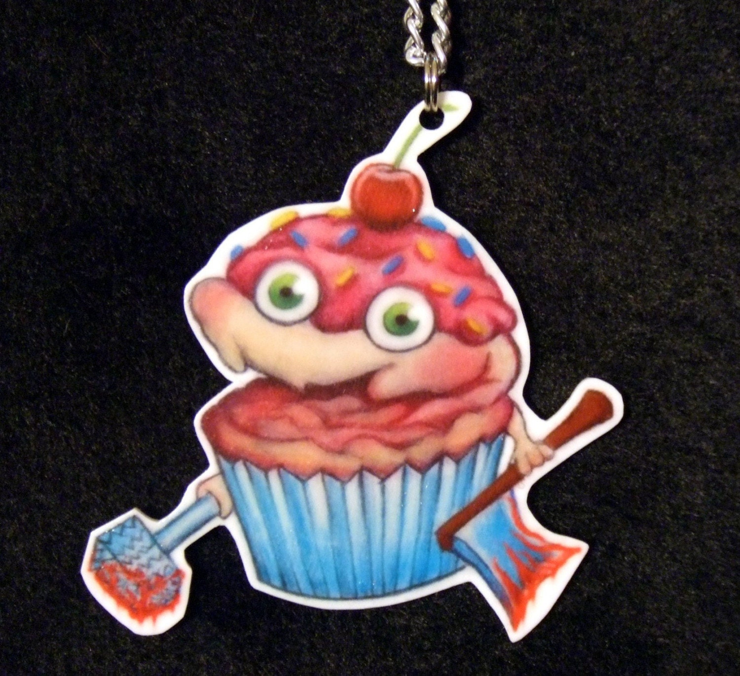 evil killer cupcake w smile icing sprinkles bloody axe n