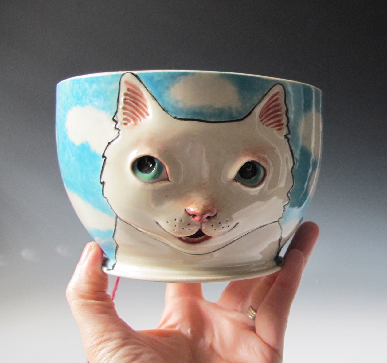 White Cat Yarn Bowl sculpted kitty against blue sky by MaidOfClay