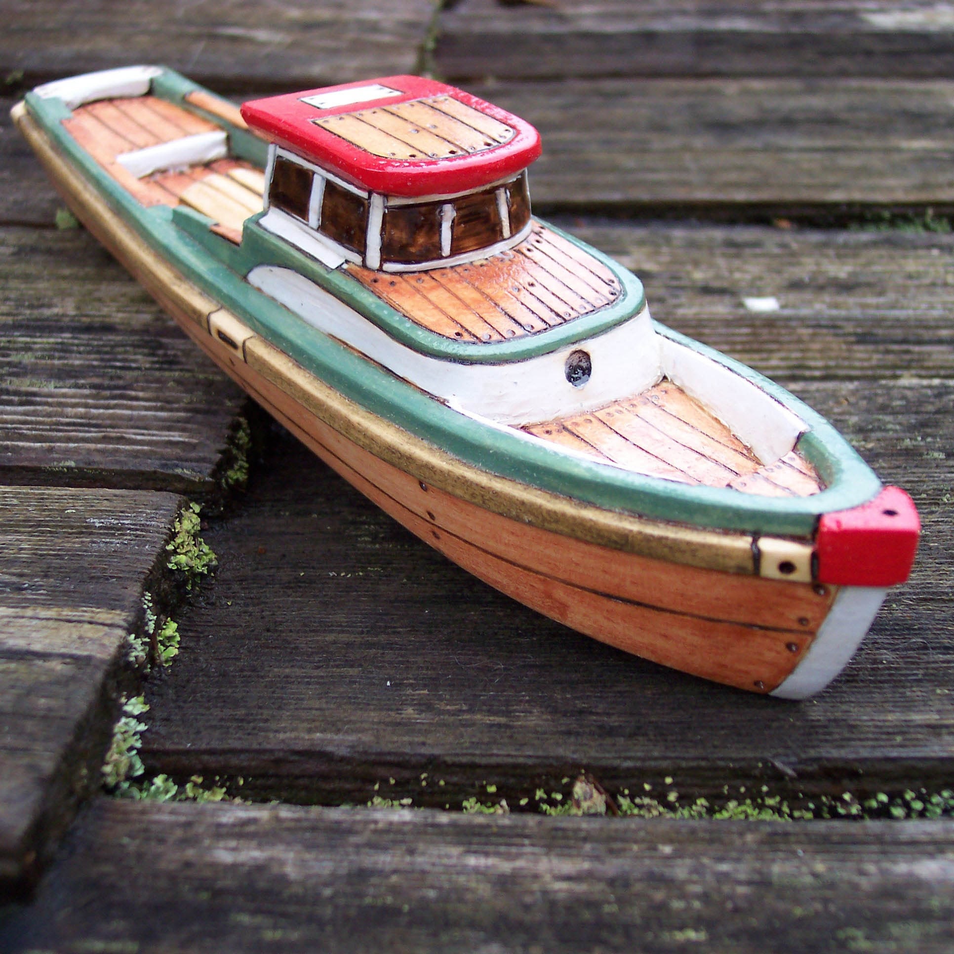 the green lobster wooden toy boat