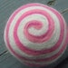 One multi-colored felted pin-cushion, White and Pink