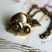 loves photography. camera necklace. brass ox