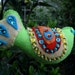 Sequined Bird Christmas ornament green with yellow, orange and turquoise