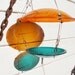 Bird Feeder. Repurposed Recycled street lights. Fat Ol' Sun over Emerald Blue Water. 3 dollars goes to the National Audubon