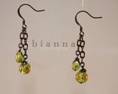Items similar to olive green 2 drop earring on gunmetal chain on Etsy