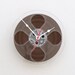 Clock made from a recycled magnetic tape reel