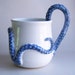 White Monster Mug in the Clutches of a True Blue but Obviously DementedTentacled Sea Monster
